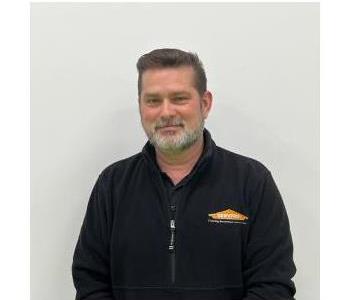 Male Employee smiling with white background