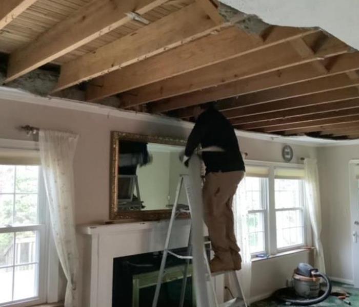 technician removing ceiling 