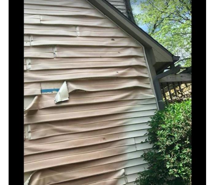 siding melted on residential home
