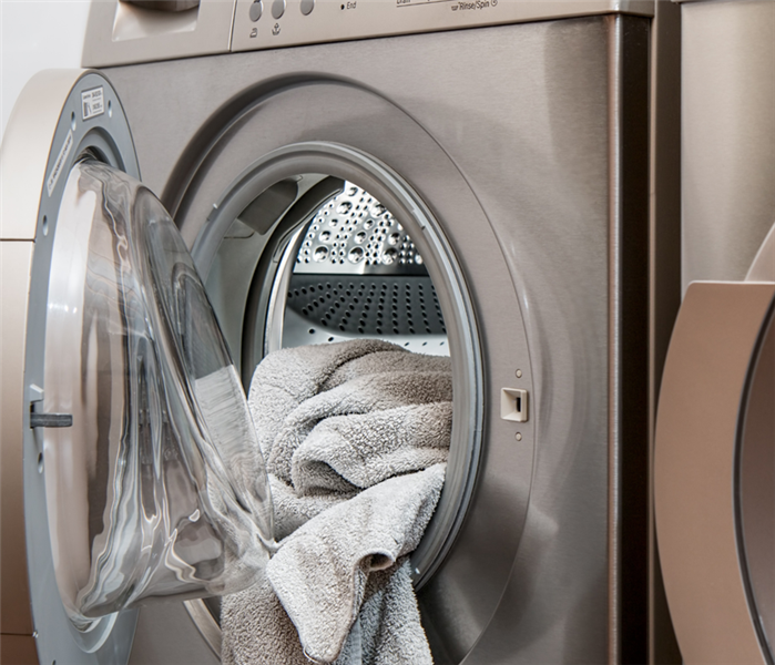 washing machine with gray towel in it